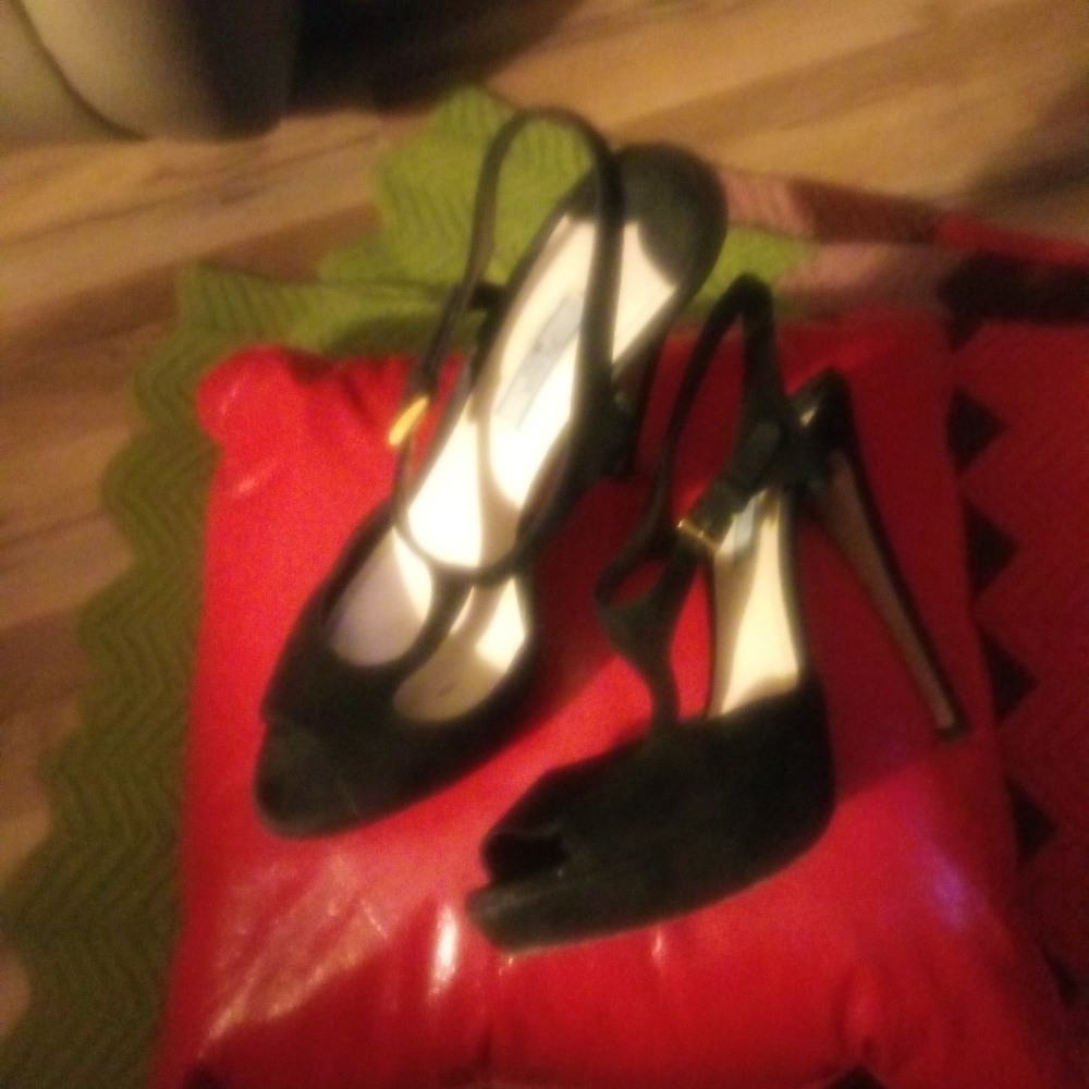 Black suede Prada 5 inch heels.
